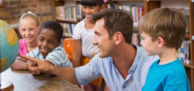 Male teacher with students
